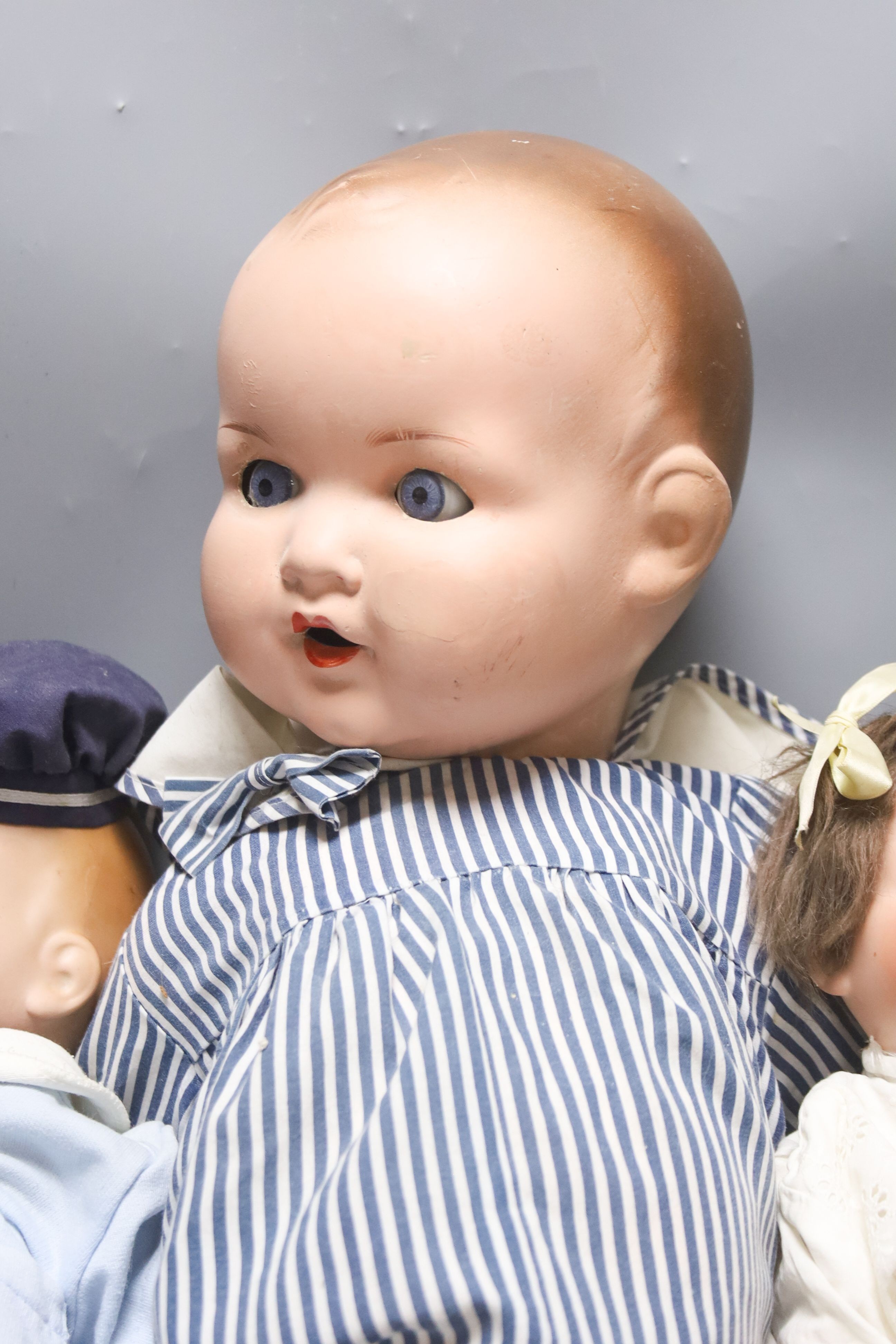 A bent limb AM H.14in. AM baby open mouth H.15in. AM baby painted bisque H23in.